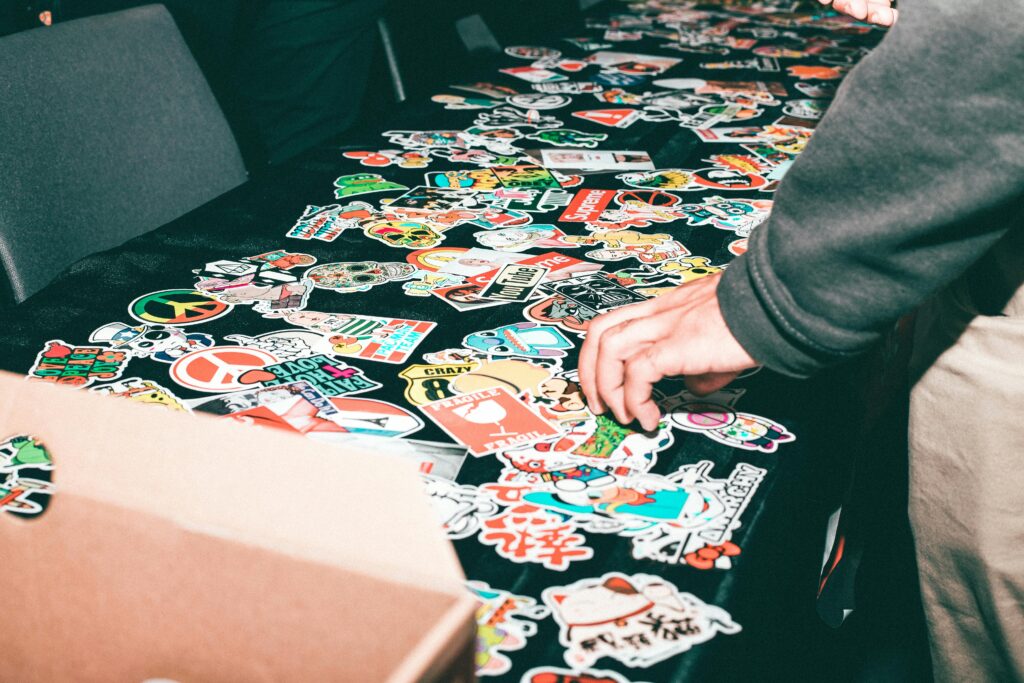 Vibrant assortment of stickers displayed on a table indoors.